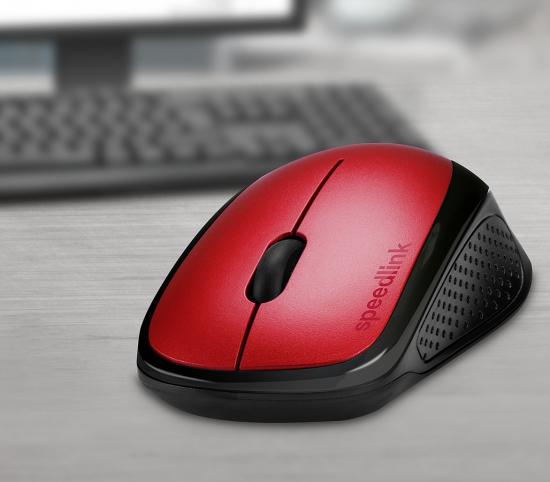 Rote kabellose Computermaus mit glatter Oberfläche und ergonomischem Design, im Hintergrund unscharfe Tastatur
