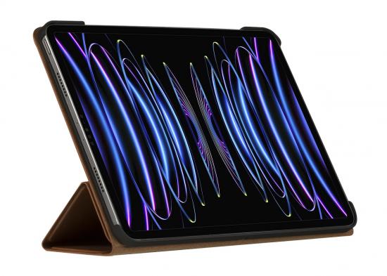 Tablet mit Displayschoner, der blaue Lichtwellen zeigt, auf einem braunen Ständer